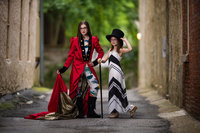 two young girls playing dress-up at a portrait session