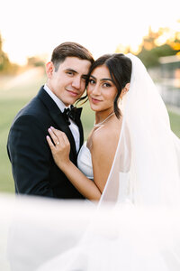 Bride strikes a pose with her wedding bouquet