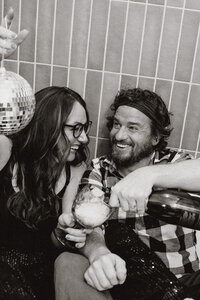 Couple partying in a bathtub with champagne and a disco ball in Breckenridge, Colorado.