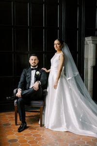 Bride and groom sharing a romantic moment outside the Scranton Cultural Center, surrounded by elegant architecture and soft natural light.
