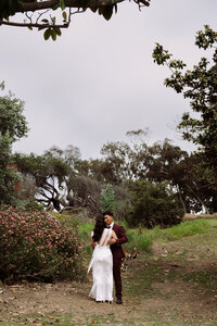 happy wedding couple hugging dancing at elopement destination wedding