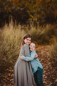 two children in family photo shoot outdoors