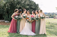 bride and bridesmaids outside at boxwoods