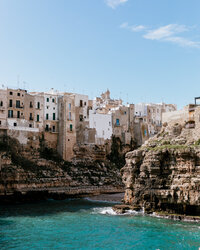 buildings on cliff over ocean