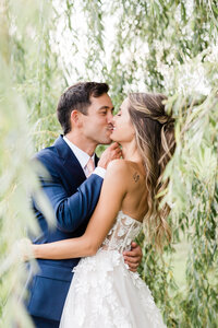 couple under a willow tree . Wedding  Photography by jana scott photography