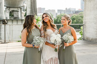 Bride laughing with her bridesmaids at The Bridge Building in Downtown Nashville