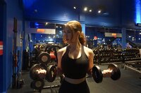Elizabeth West, a personal trainer in Boca Raton, performing a dumbbell curl.