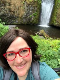 Standing in front of a beautiful waterfall in Washington State, the perfect location for a  destination