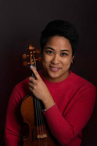 woman holding violin