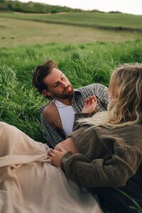 North Carolina couples photo shoot in a green grassy field