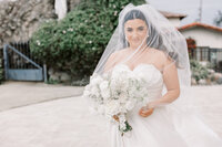 bay area photographers captures wedding stationary and florals laying on a white background for luxury wedding photos