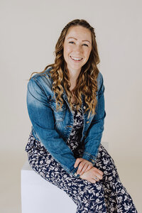 Katie Reichert, founder of Reichert Creative, smiling confidently—representing her expertise in digital marketing, email list growth, and small business branding.