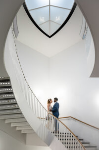 Bride and groom on the staircase at the Museum of  Contemporary Art