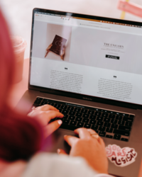 Photography Coaching | Karinda K | Typing on a laptop