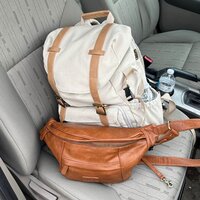 A picture of Danielle Rose Photography's backpack and gear, packed and ready for an adventure, showcasing the tools and equipment used to capture unforgettable moments during a wedding or elopement.