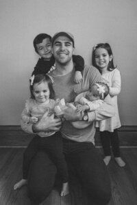 black and white film photo of Reese and his 4 kids