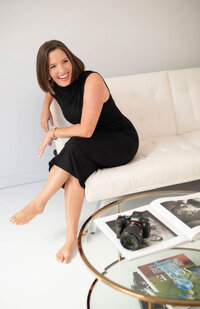 woman smiling in a couch