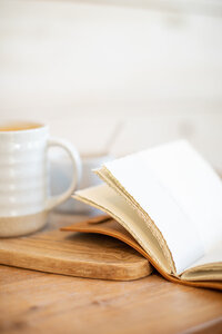 close up of book and coffee mug
