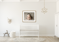 newborn photography canvas hangs on wall.