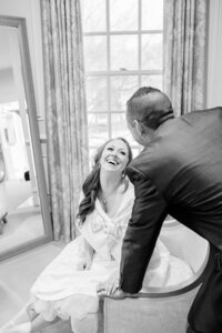 A bride and groom share a moment inside the Great Marsh Estate and Northern Virginia Wedding Photographer captures it
