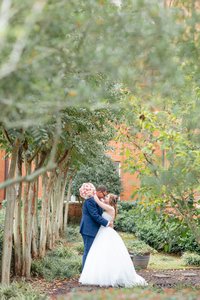 Bride and groom walk up memorial steps at their DC wedding