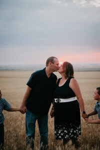 Family photo session in Circle, MT, capturing a family’s love and connection against the stunning backdrop of Montana's wide-open landscapes, perfect for creating lasting memories in a peaceful, rural setting.