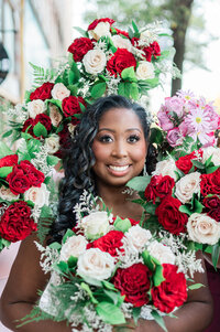 A bride with flower arrangements surrounding her face