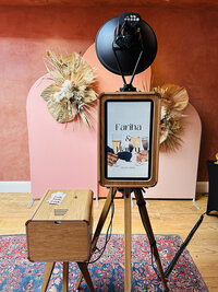 a modern wooden photo booth with a sleek design, perfect for weddings, large events, birthday parties and so much more!