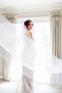 Bride getting ready with long veil