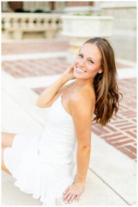 Senior guy smiles with arms crossed for Hamilton Montana senior pictures
