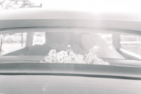 black and white image of bride and groom holding hands