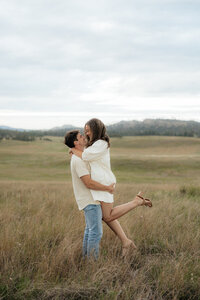 Couple standing forehead to forehead.