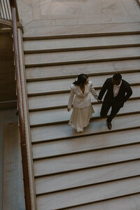 Engagement session in the Art Institute of Chicago, walking down the stairs