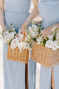 bridemaids bouquets being held in basket