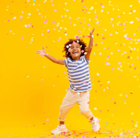 excited child with confetti