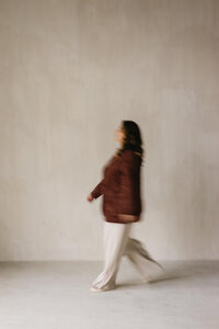 blurry image of woman walking