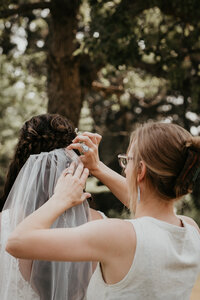 Chelise Boysun at work in Dickinson, ND, capturing a couple’s intimate wedding moments against the backdrop of North Dakota’s expansive rural landscape. Chelise’s attention to detail and love for nature bring each couple’s love story to life.