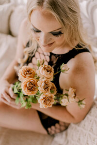 bridesmaids huging eachother looking into the camera