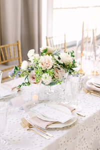 Refined Southern garden wedding reception table with blush florals, candles, and gold flatware in Oklahoma