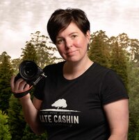 headshot of Kate Cashin holding her camera