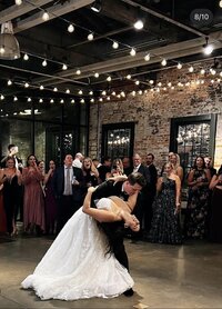 Wedding couple dipping at the end of their first dance