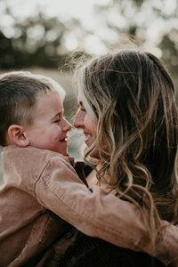 Family photography session in Medora, ND, capturing beautiful moments of connection with the stunning natural beauty of Theodore Roosevelt National Park in the background. Ideal for families looking to preserve memories in a breathtaking outdoor setting.