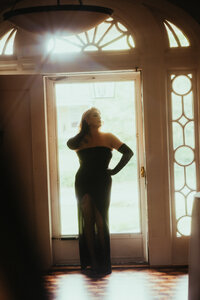 A galaxy surrounds a womans head like a crown.