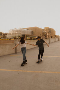 Jackie and Michael riding their blackout Penny boards in a parking garage in downtown Boise