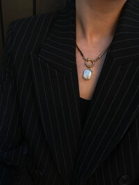 woman striped suit jacket necklace