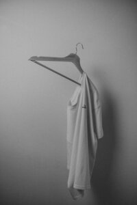 white tshirt on hanger image black and white photo
