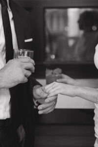 Engaged couple hold hands while taking their engagement photos at The Rose Garden cocktail bar in downtown Phoenix. 