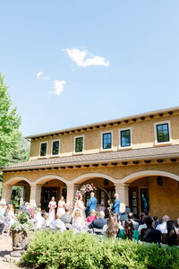 Bride and groom kissing at the Conservatory at Gervasi Vineyard photographed by akron ohio wedding photographer