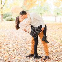 engaged couple dip kiss in the fall leaves in Boise Idaho