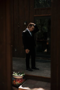 groom fixing hair